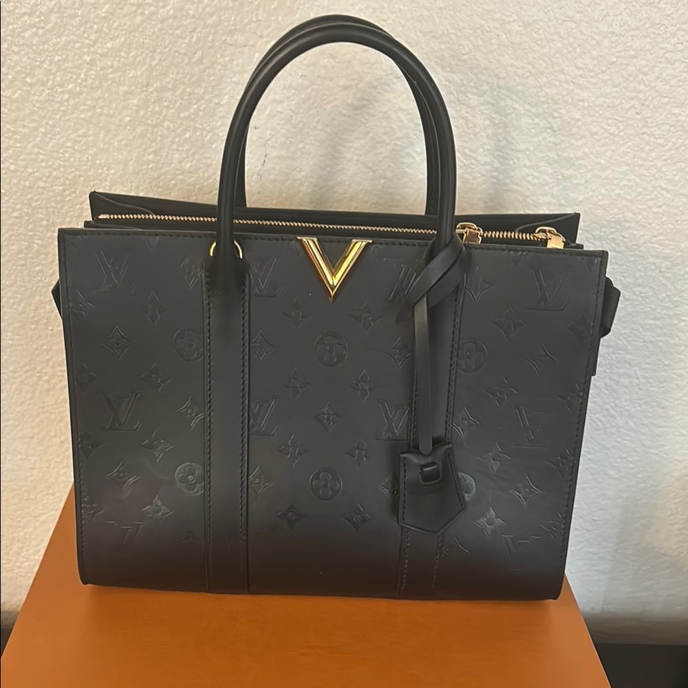 Louis Vuitton Black Satchel with Gold Accent and Structured Design